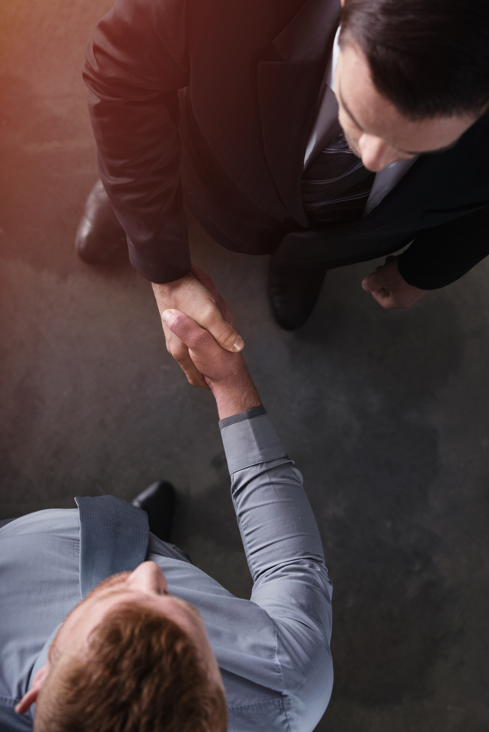 Handshaking Business Person in Office. Concept of Teamwork and Partnership